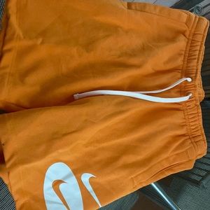 Men’s Nike standard fit above knee length shorts. Orange